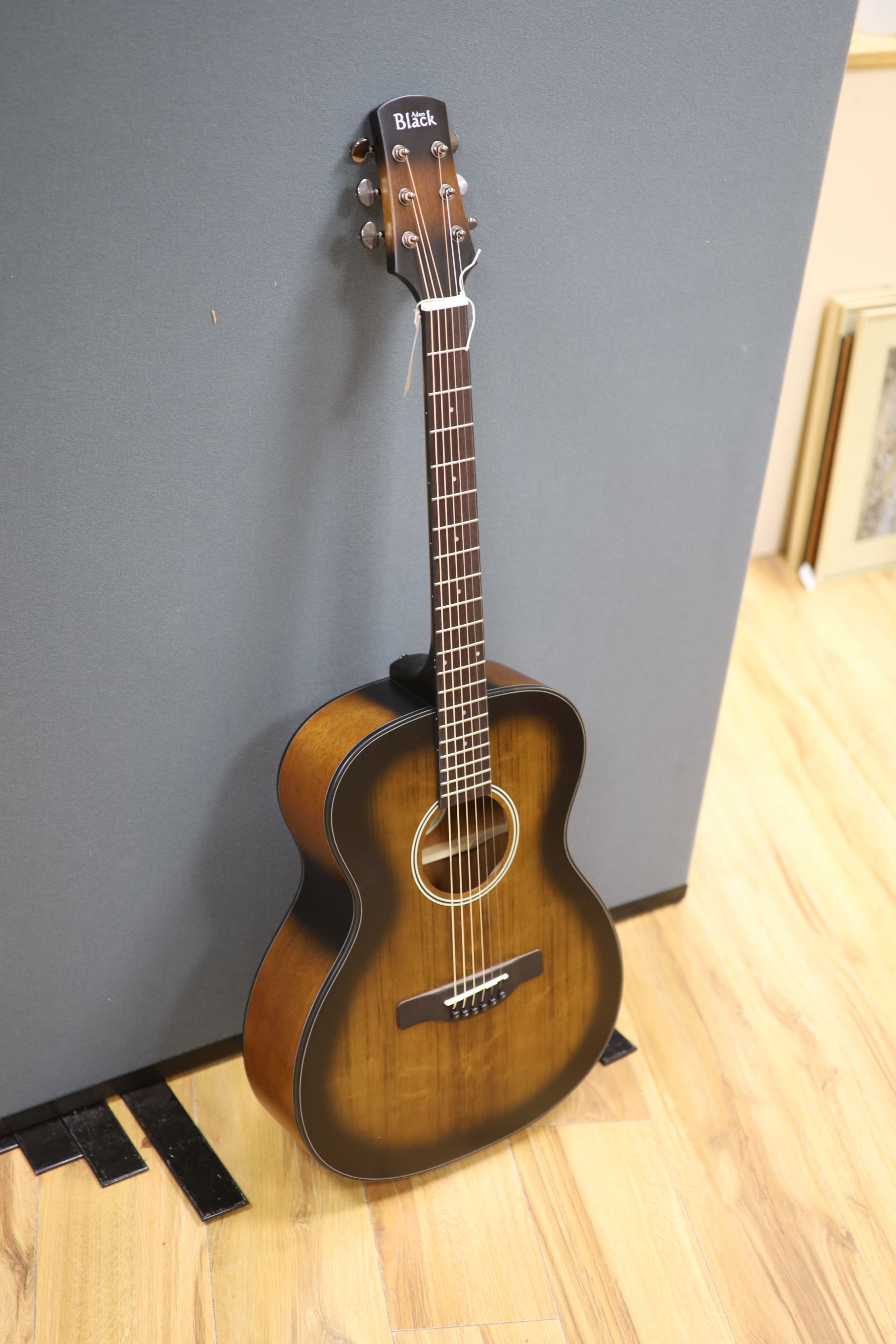 An Adam Black acoustic guitar